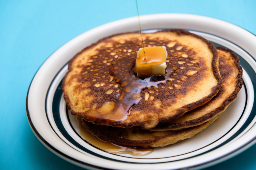 Low carb keto pancakes with sugar-free maple style syrup, and butter.