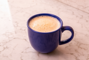 blue mug containing bulletproof keto tea