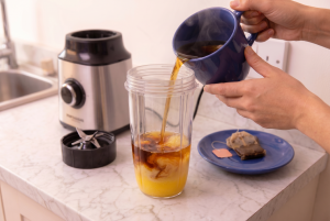 tea being poured into the blender
